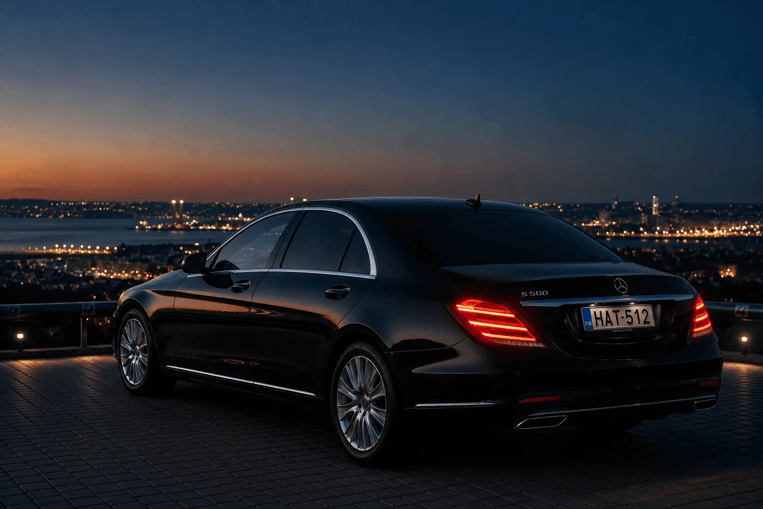 Black Mercedes S-Class with Helsinki Airport Taxi plates at dusk overlooking the city